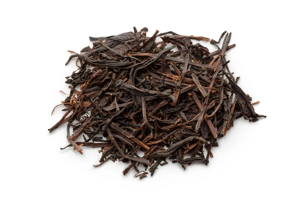 Black tea on white background