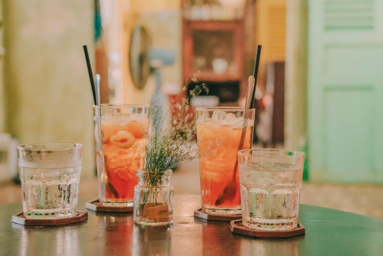 clear glass with water and lychee drink