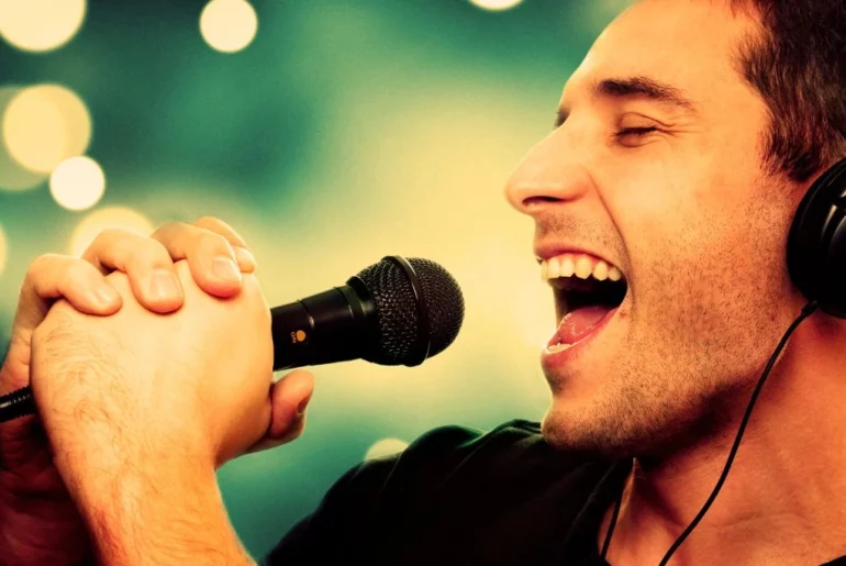 male singer with a microphone in his hands