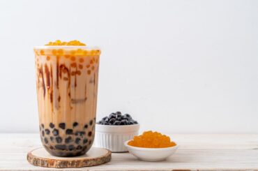 Milk tea and boba pearls in a bowl