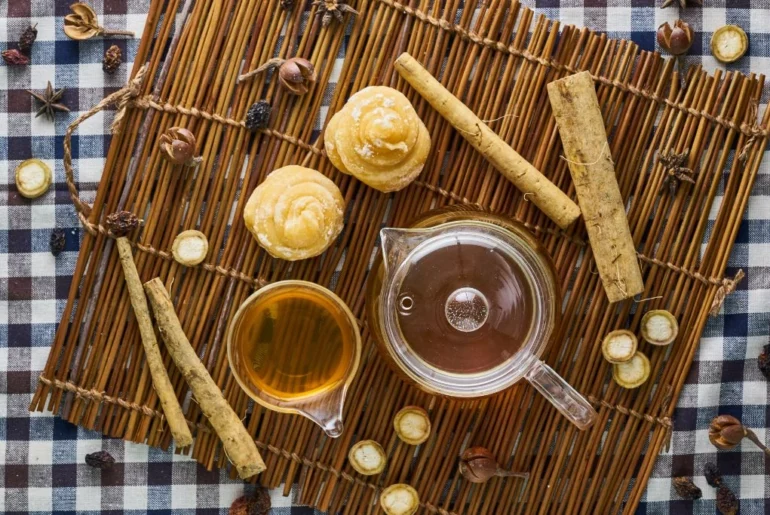 A complete set of tea making tools on a placemat