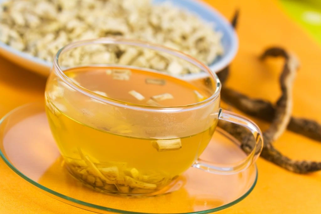 A cup of Marshmallow Root Tea on a glass saucer