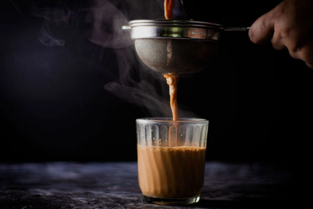 Pouring coffee over a Sieve and then to the cup