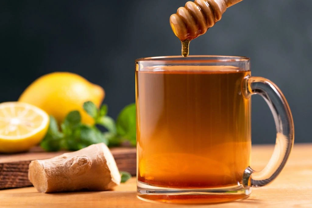 Honey syrup tea poured on a glass jar