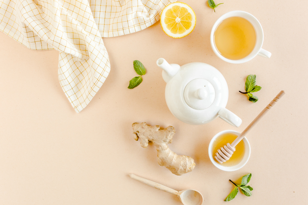 cup and pot of tea with honey