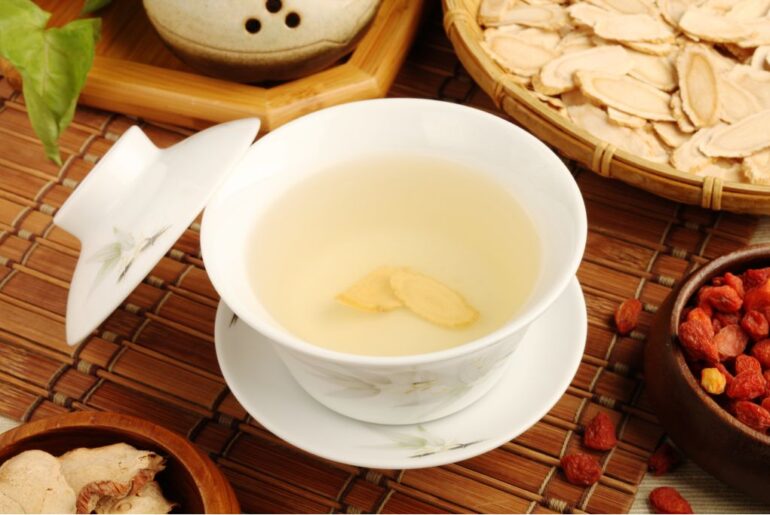 a cup of traditional ginseng tea and herbs