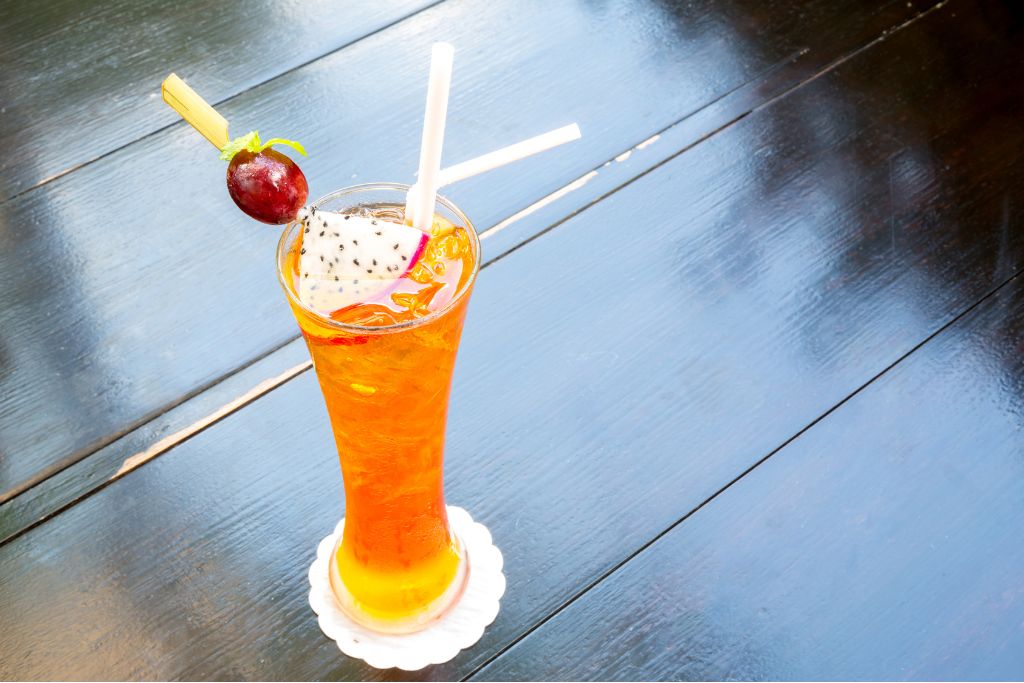 earl grey iced tea with grape and dragon fruit as garnish