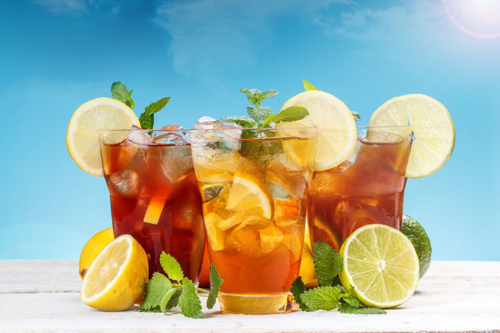 fresh and cold iced tea with sliced lemon and mint