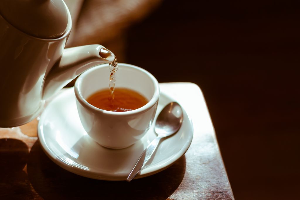 pouring tea from a teapot