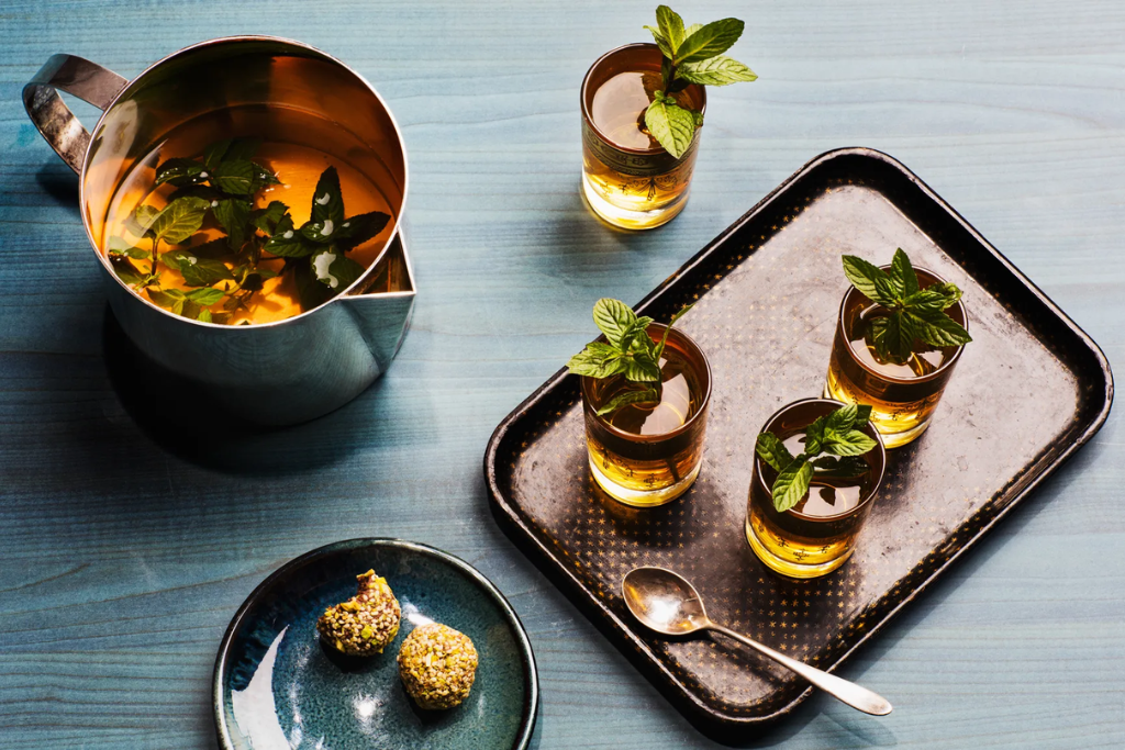 a pitcher and 3 glass with moroccan mint tea