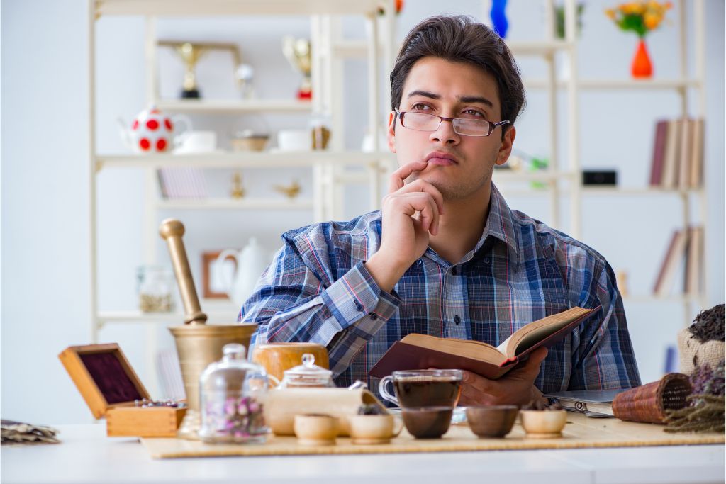 Tea enthusiast preparing a tea along with other ingredients