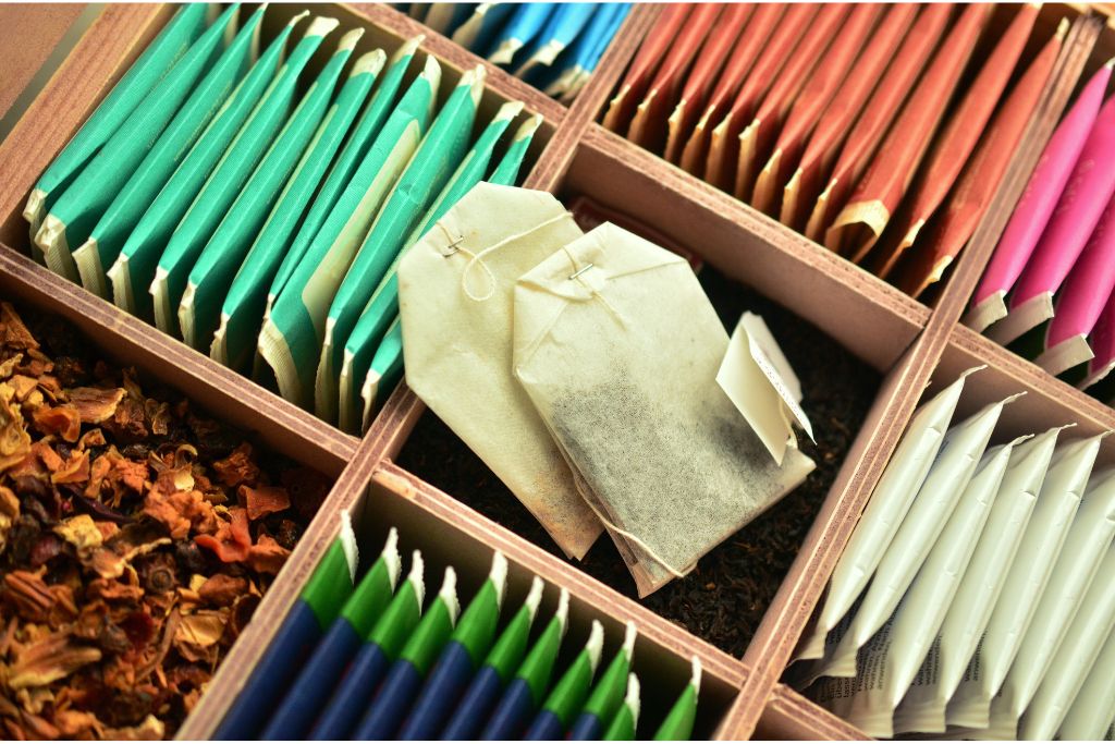 Assorted tea with tea bags and dried tea leaves