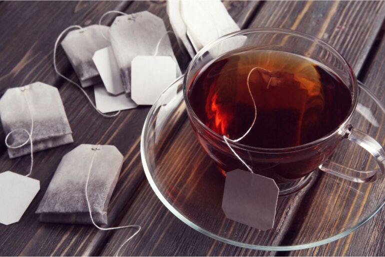 Tea bags and brewed tea in a cup