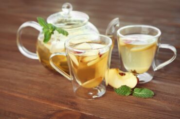 Homemade Apple Mint Tea with tea cup on table