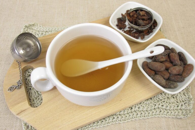 cup of chocolate tea on wooden serving board