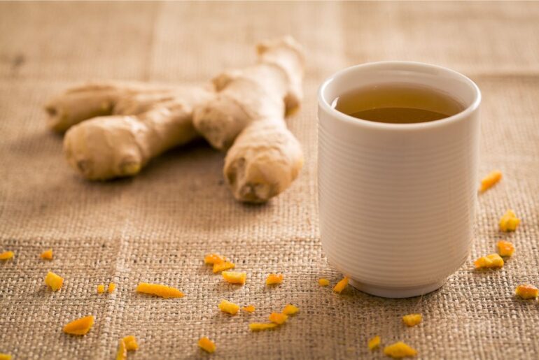 a white cup of a ginger tea