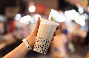 Holding a large cup of iced classic milk tea
