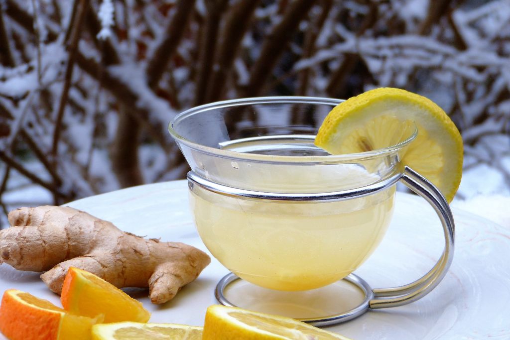 lemon ginger with a slice of lemon and ginger on a snowy background