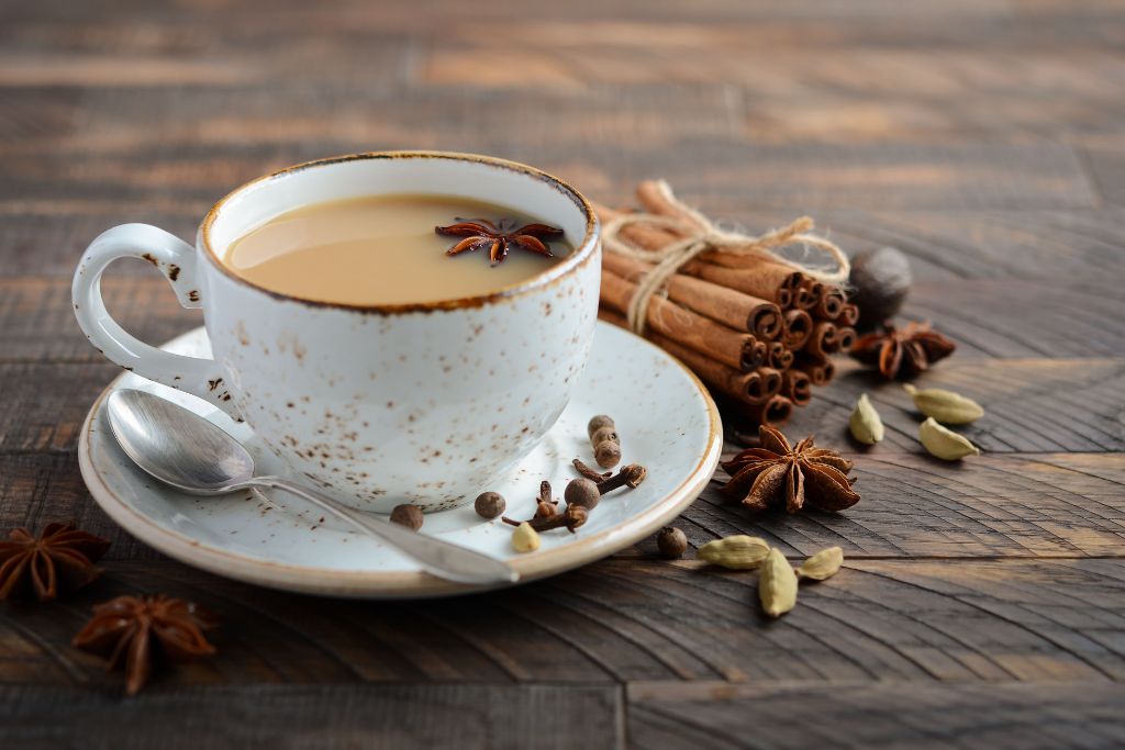 a hot cup of tea with cinnamon, cardamom, and vanilla