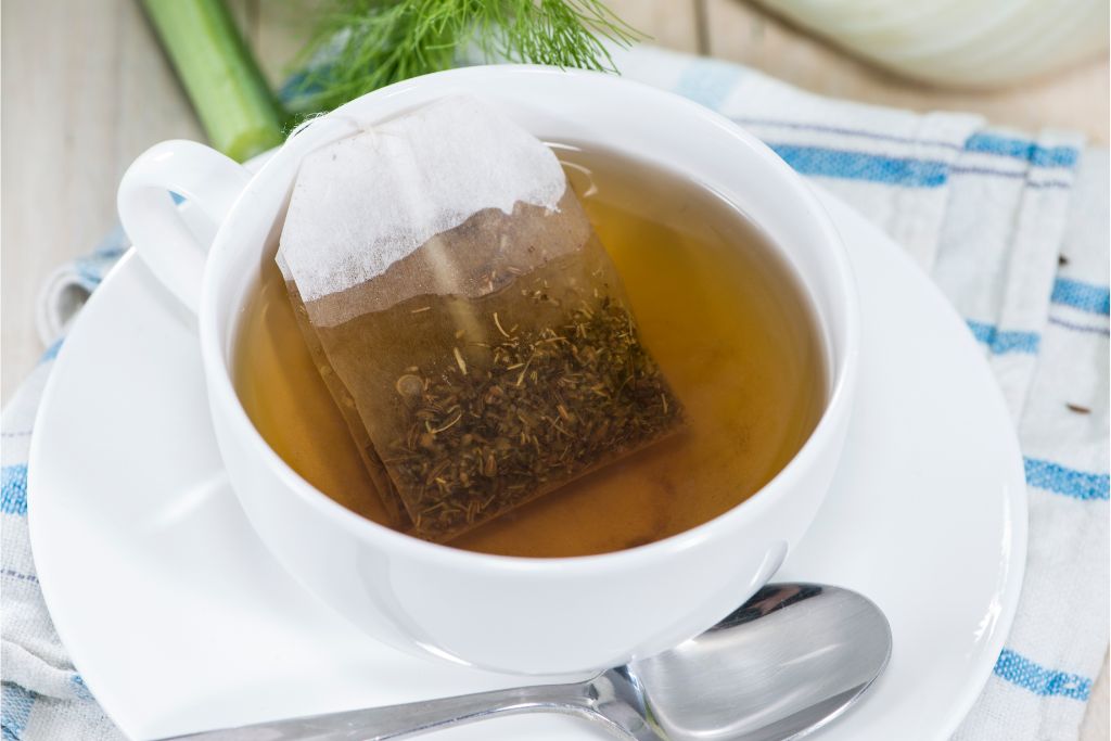 fennel tea bag soaked in a white cup